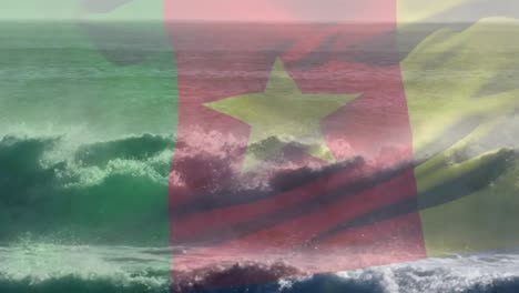 Digitale-Komposition:-Die-Flagge-Kameruns-Weht-Vor-Der-Luftaufnahme-Der-Wellen-Im-Meer