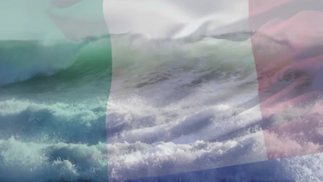 Animation-of-flag-of-italy-blowing-over-beach-seascape