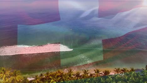 Digital-composition-of-switzerland-flag-waving-against-aerial-view-of-waves-in-the-sea