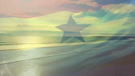 Animación-De-La-Bandera-De-Ghana-Ondeando-Sobre-El-Paisaje-Marino-De-La-Playa.