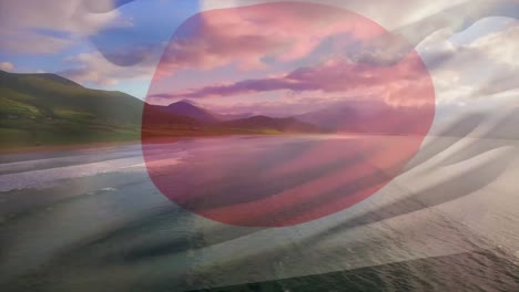 Animation-of-flag-of-japan-blowing-over-beach-landscape