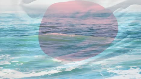 Animation-of-flag-of-japan-blowing-over-beach-seascape