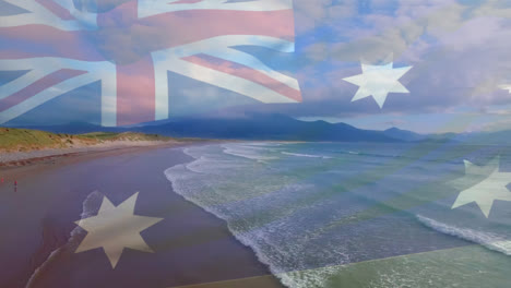 Digital-composition-of-australia-flag-waving-against-aerial-view-of-waves-in-the-sea