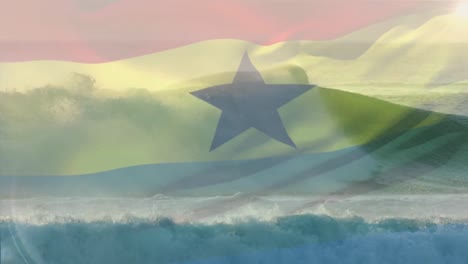 Composición-Digital-De-La-Bandera-De-Ghana-Ondeando-Contra-La-Vista-Aérea-De-Las-Olas-En-El-Mar.