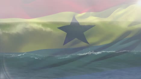 Digitale-Komposition-Der-Ghanaischen-Flagge,-Die-Vor-Der-Luftaufnahme-Der-Wellen-Im-Meer-Weht