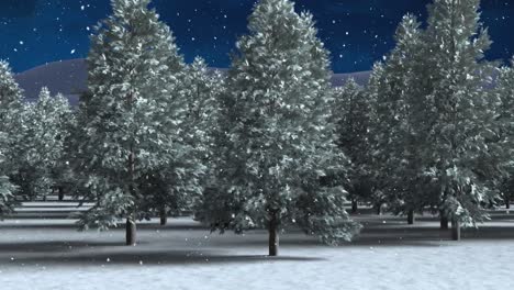 Snow-falling-over-multiple-trees-on-winter-landscape-against-night-sky