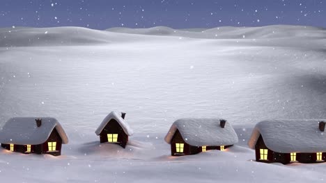 Snow-falling-over-multiple-houses-on-winter-landscape-against-night-sky