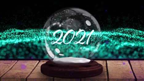 Animation-of-2021-in-snow-globe-on-wooden-boards,-shooting-star-and-green-mesh