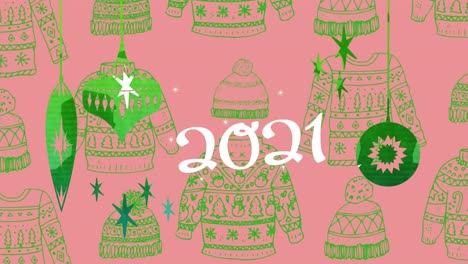 Animation-of-2021-text-over-jumper-pattern-on-pink-background