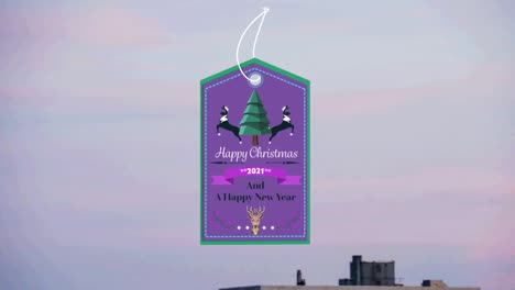 Animation-of-christmas-greetings-on-tag-over-cityscape-in-background