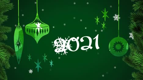 Animation-of-2021-over-snow-falling-and-christmas-bauble-decorations-on-green-background