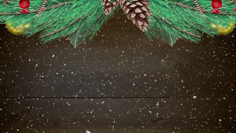 Animation-of-fir-tree-branches-and-christmas-decorations-over-snow-falling