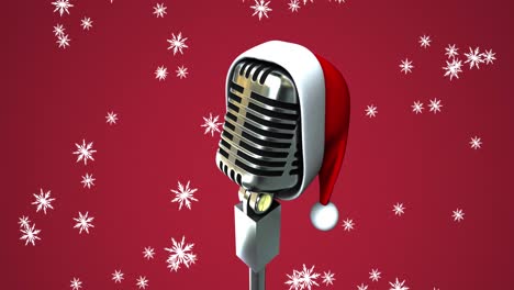 Animation-of-snow-falling-over-vintage-microphone-with-santa-hat-on-red-background