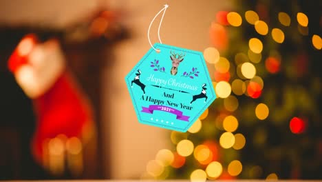 Animation-of-christmas-greetings-on-tag-over-bokeh