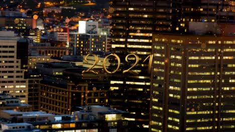 Animation-of-2021-text-with-orange-spots-falling-over-cityscape-background