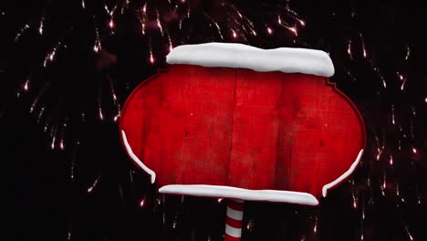 Animation-of-fireworks-over-red-tag-covered-with-snow