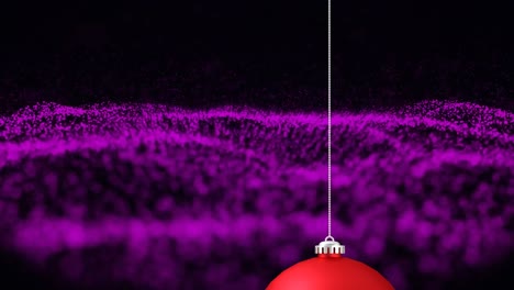 Animation-of-red-christmas-bauble-and-purple-waving-mesh-on-black-background