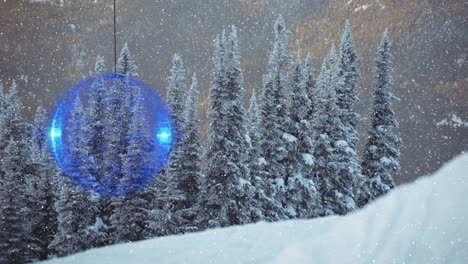 Animation-of-snow-falling-and-blue-christmas-bauble-over-winter-countryside-scenery