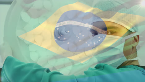 Animation-of-flag-of-brasil-waving-over-surgeons-in-operating-theatre