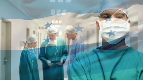 Animation-of-flag-of-honduras-waving-over-surgeons-in-hospital-corridor