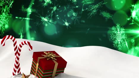 Animation-Von-Schnee,-Der-über-Weihnachtssüßigkeiten-Und--geschenke-Auf-Grünem-Hintergrund-Fällt