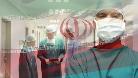 Animation-of-flag-of-iran-waving-over-surgeons-in-hospital-corridor
