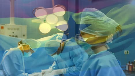 Animation-of-flag-of-ghana-waving-over-surgeons-in-operating-theatre