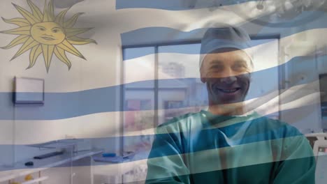 Animation-of-flag-of-uruguai-waving-over-surgeon-in-operating-theatre