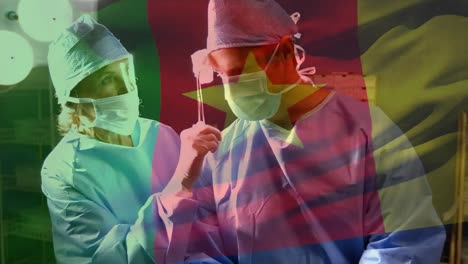 Animation-of-flag-of-cameroon-waving-over-surgeons-in-operating-theatre