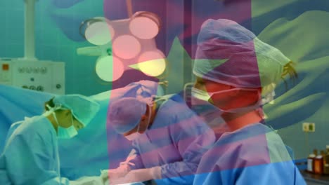 Animation-of-flag-of-cameroon-over-surgeons-in-operating-theatre