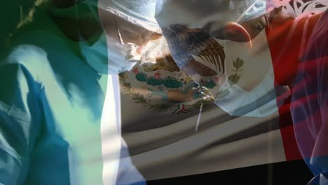 Animation-of-flag-of-mexico-over-surgeons-in-operating-theatre