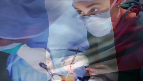 Animation-of-flag-of-france-over-surgeons-in-operating-theatre
