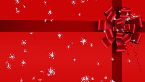 Animation-of-snow-falling-over-ribbon-on-red-background