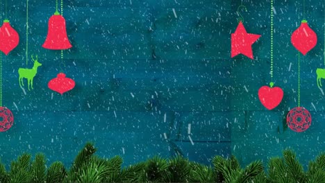 Animation-Von-Weihnachtsdekoration-Und-Schnee,-Der-Auf-Blauen-Hintergrund-Fällt