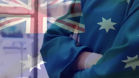 Animation-of-flag-of-australia-waving-over-surgeon-in-operating-theatre