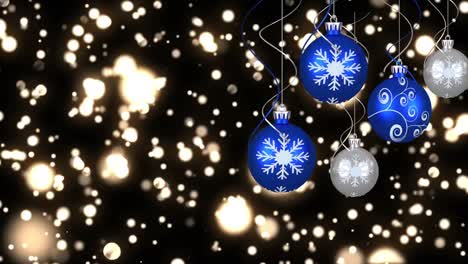 Animation-of-christmas-bubbles-over-glowing-spots-on-black-background