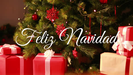 Animation-of-spanish-christmas-greetings-over-christmas-tree-and-presents