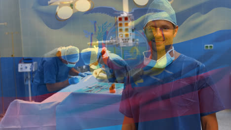 Animation-of-flag-of-equador-waving-over-surgeons-in-operating-theatre