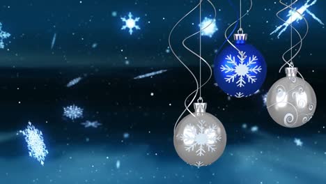 Animation-of-christmas-bubbles-over-snow-on-blue-background