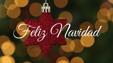 Animation-of-spanish-christmas-greetings-over-christmas-red-star-bauble