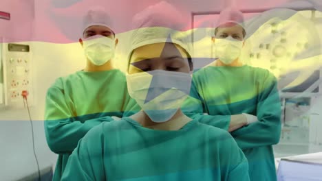 Animation-Der-Flagge-Ghanas,-Die-über-Chirurgen-Im-Operationssaal-Weht