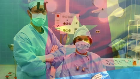 Animation-of-flag-of-cameroon-waving-over-surgeons-in-operating-theatre