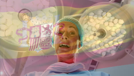 Animation-of-flag-of-spain-waving-over-female-surgeon-in-operating-theatre