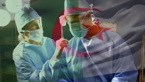 Animation-of-flag-of-algeria-waving-over-surgeons-in-operating-theatre
