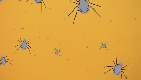 Animation-of-falling-spiders-on-orange-background