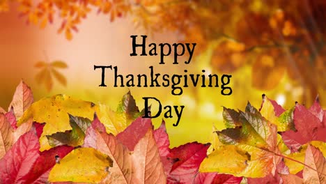 Animation-of-happy-thanksgiving-day-text-over-autumn-leaves-scenery