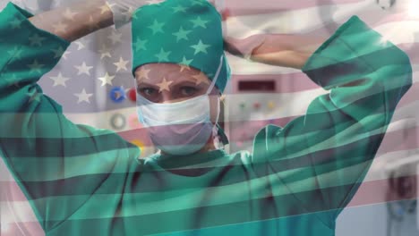 Animation-of-flag-of-usa-waving-over-female-surgeon-in-operating-theatre