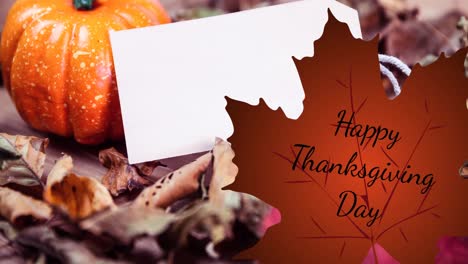 Animation-of-thanksgiving-text-over-white-card-with-copy-space-and-pumpkin-with-autumn-leaves