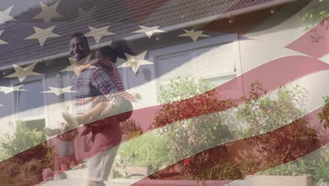 Animation-of-flag-of-united-states-of-america-over-african-american-father-and-daughter-having-fun