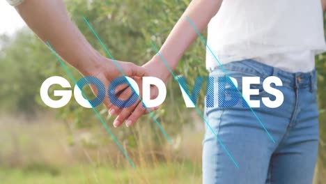 Animation-of-good-vibes-text-over-happy-people-outdoors